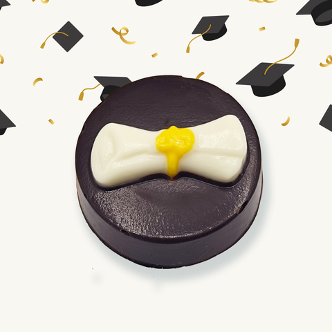 Up close view of one of the chocolates contained in the box, a graduation letter chocolate 