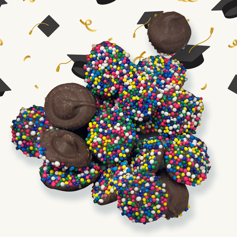 Graduation-themed chocolates with rainbow sprinkles on a festive background, perfect for celebrating academic milestones.