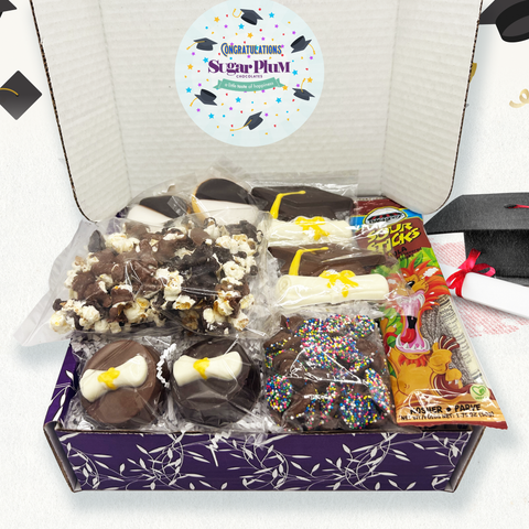 Graduation gift box with chocolate, cookies, popcorn, and sour candy celebrating academic milestones.