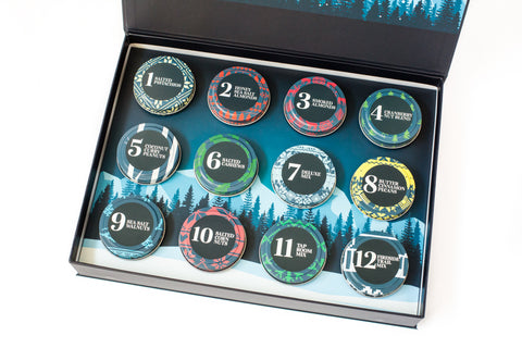 Gourmet Nuts Advent Calendar with 12 tins of mixed nuts in a festive holiday gift box, perfect for Christmas gifting.