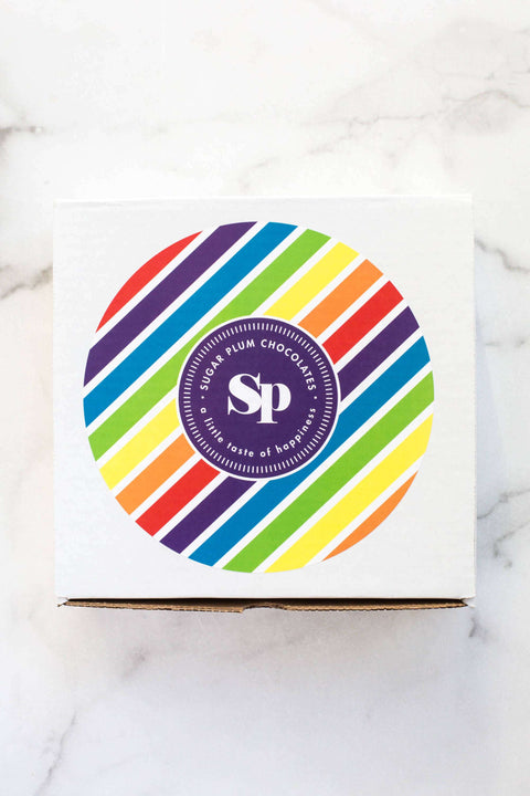 Happy Birthday Box with colorful striped design from Sugar Plum Chocolates for fun birthday treats.