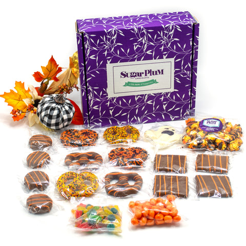 Halloween Boo Box with chocolate-covered pretzels, cookies, caramel corn, and festive treats in black and orange packaging.