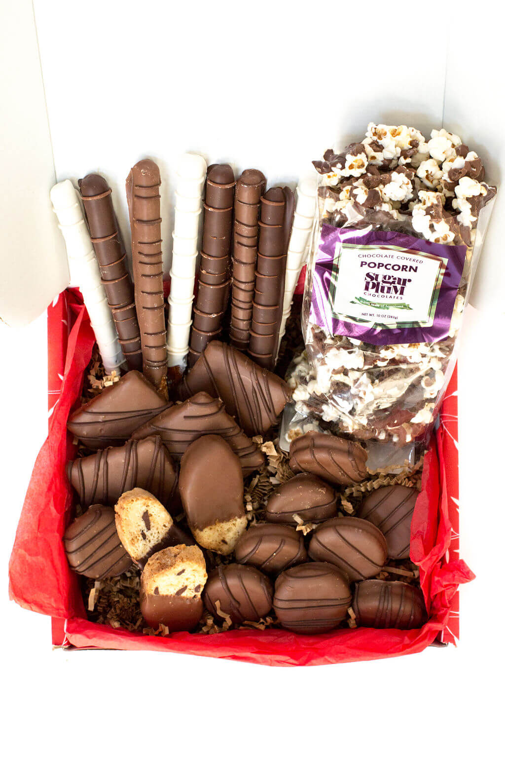 Chocolate Eruption Gourmet Gift Box with 26 hand-dipped treats including chocolate-covered popcorn, cookies, pretzels, and more.
