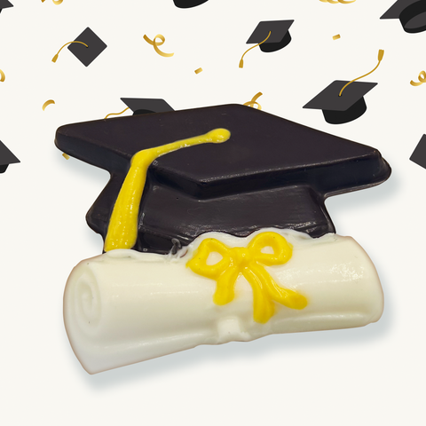 Up close view of one of the chocolates contained in the box, a graduation cap chocolate 