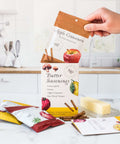 Butter seasonings spice pack in kitchen with Apple Cinnamon, Lemon Garlic, Umami Butter, and Sun-Dried Tomato flavors for cooking.
