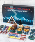 "12 Days of Winter Wonder Gourmet Advent Calendar with Meat Sticks and Nut Medley Gift Box on a Countertop"