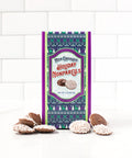 Milk Chocolate Holiday Nonpareils in festive box with scattered nonpareils, perfect for gifting or holiday treats.