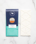 Cinnamon Roll White Chocolate Bar with packaging, featuring handcrafted design and nostalgic candy flavors.