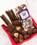 Chocolate Eruption Gourmet Gift Box with hand-dipped pretzels, cookies, and popcorn, ideal for gifting or sharing.