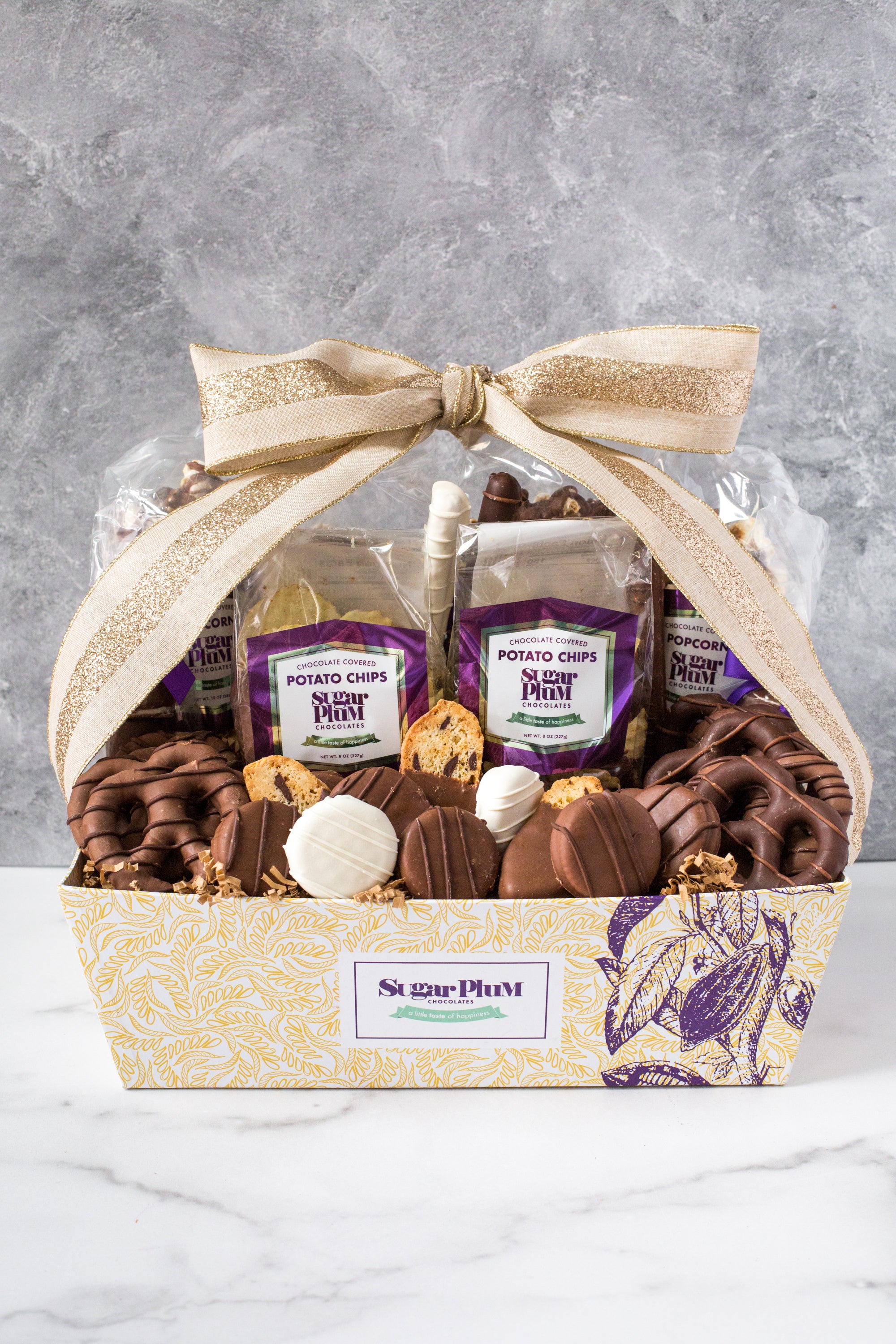 Luxurious 40-piece Chocolate Kilimanjaro Gift Basket by Sugar Plum with assorted gourmet chocolate treats and snacks.