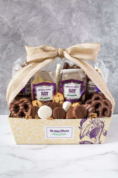 Luxurious 40-piece Chocolate Kilimanjaro Gift Basket by Sugar Plum with assorted gourmet chocolate treats and snacks.