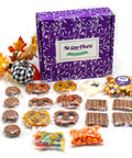 Halloween Boo Box with chocolate-covered pretzels, cookies, caramel corn, and festive treats in black and orange packaging.