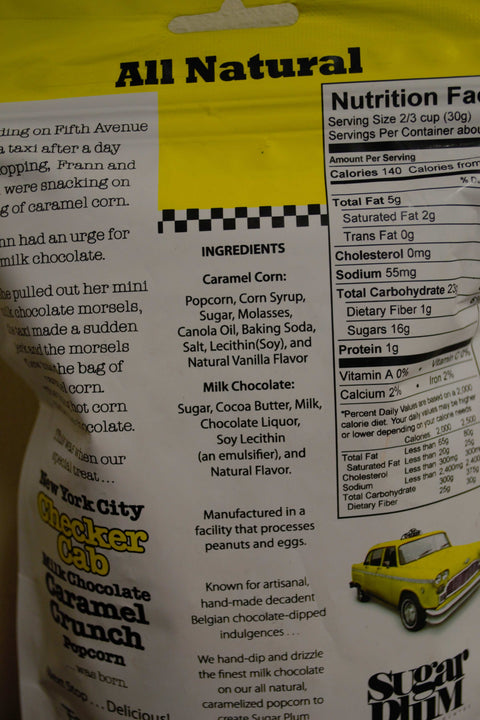 NYC Checker Cab Milk Chocolate Caramel Crunch Popcorn packaging with ingredients and nutritional information.
