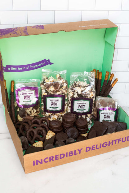 Luxurious 42-piece Double Decadence Dark Chocolate Gift Box with handcrafted snacks, ideal for gifting and special occasions.