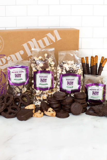 Double Decadence Dark Chocolate Gift Box with 42 gourmet snacks including popcorn, pretzels, and potato chips, perfect for gifting.