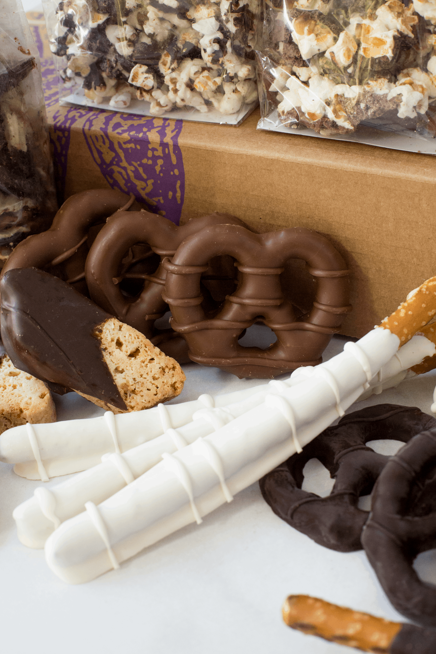 Gourmet chocolate pretzels and snacks assortment from Sugar Plum's Double Decadence gift box, perfect for holidays and special occasions.