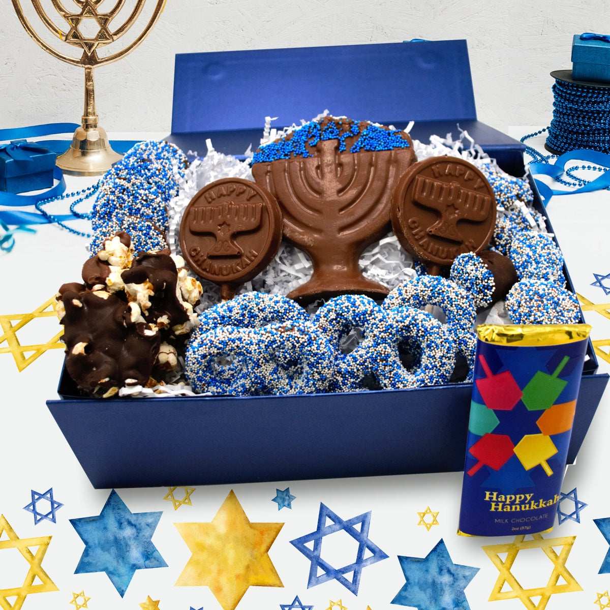 Hanukkah chocolate box with menorah-shaped chocolates and festive blue decorations, celebrating the Festival of Lights.