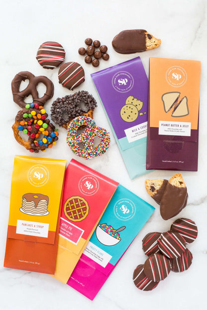 Nostalgic Chocolate Bar Gift Box with assorted handcrafted bars and treats, featuring flavors like Peanut Butter & Jelly and Pancake & Syrup.