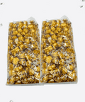 Two-pack of Sugar Plum's handcrafted caramel corn with white and milk chocolate drizzle in clear packaging.