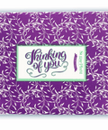 Decorative purple box with "Thinking of You" message, part of Sugar Plum’s Comfort Box - 15 Gourmet Snacks Care Package.