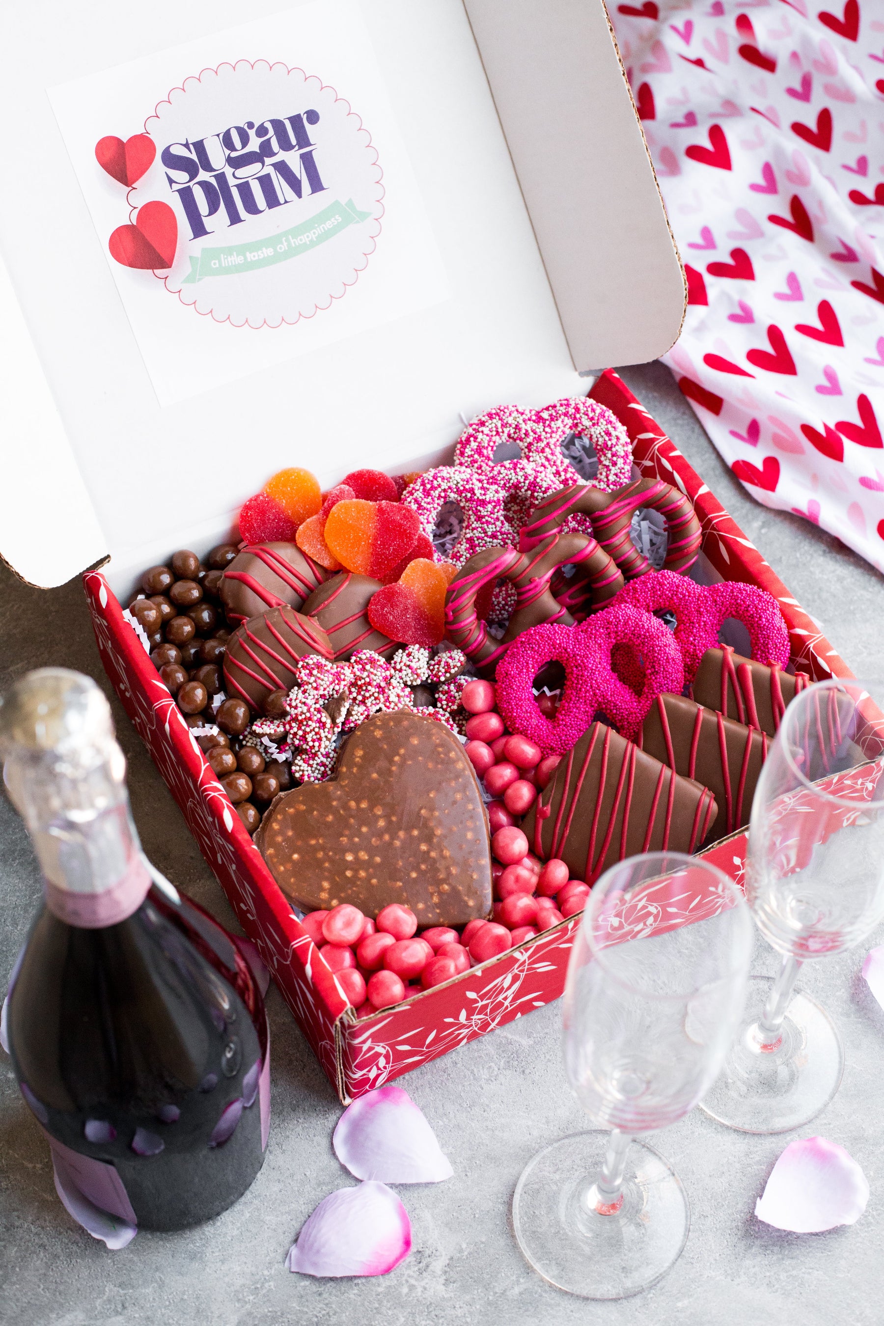 Valentine's Day Box with chocolate-covered treats, candies, and wine, perfect for a romantic celebration.