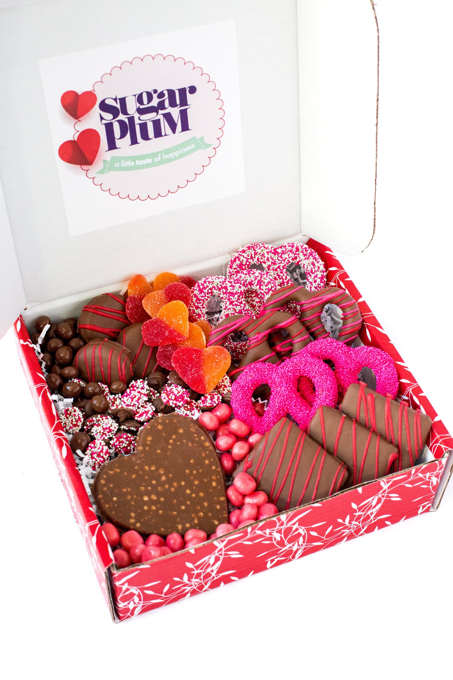 Happy Valentine's Day Box with chocolate treats, pretzels, cookies, and graham crackers, beautifully arranged for a perfect gift.