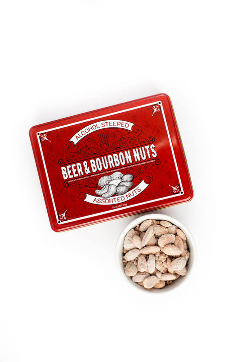 Red tin of Beer & Bourbon Nuts with a bowl of assorted gourmet nuts, perfect gift for snack lovers.