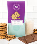 Nostalgic Milk & Cookies Chocolate Bar with a stack of cookies and a glass of milk