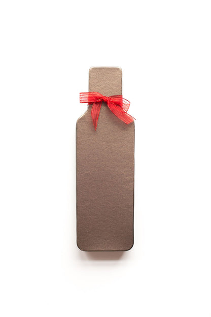 Wine bottle-shaped chocolate truffle box with red ribbon, ideal gift for wine lovers.