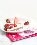 "Strawberry Cheesecake White Chocolate Bar with Fresh Strawberries on Plate"