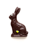 Handmade dark chocolate Easter bunny with decorative eye and flower, wrapped in a cello bag with a bow, perfect for holiday baskets.