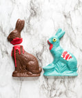 Limited Edition Chocolate Zombie Bunny and Victim Set for Halloween or Easter on marble background.
