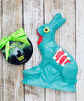 Handcrafted 7.5 oz white chocolate zombie bunny with eerie details, perfect for Halloween celebrations and spooky parties.