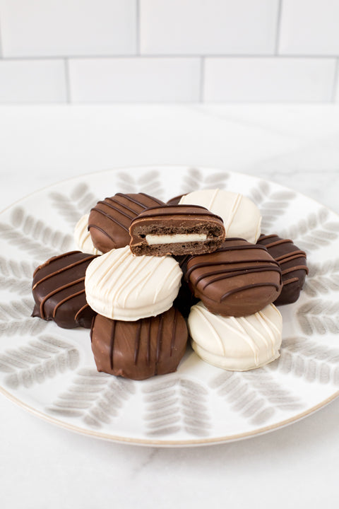 Chocolate-Covered Sandwich Cookies - Box of 12 - Sugar Plum Chocolates with assorted chocolate.