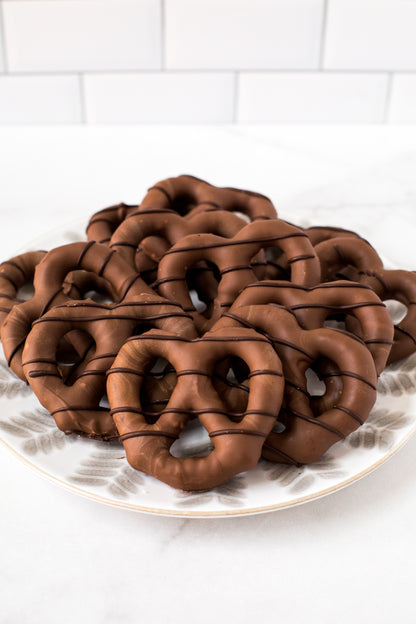 Plate of chocolate-covered pretzels, handcrafted from fresh Pennsylvania pretzels for snacking and gifting.