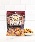 A bowl full of Rum sweetened cooked peanuts and an brown package.
