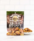 A bowl full of Irish Stout sweetened cooked peanuts and an brown package.  