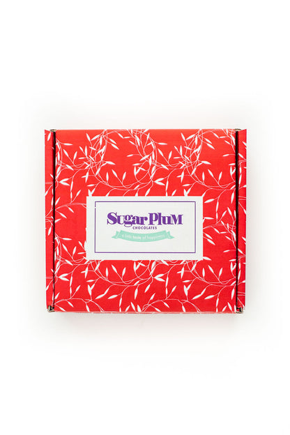 Sugar Plum Chocolate Pretzel Passion Gift Box with red floral packaging.