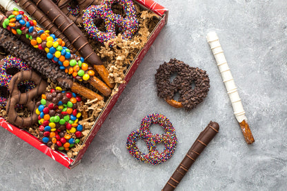 Chocolate Pretzel Passion Gift Box with assorted milk, dark, and white chocolate-covered pretzels topped with colorful candies.