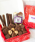 Open box full of chocolate goodies of Chocolate and Chips Gourmet Chocolate Gift Assortment