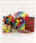 Rainbow-colored delicacies and a happy birthday gift box.  
