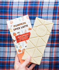 Pumpkin Spice Latte White Chocolate Bar with Fall-Themed Packaging on Plaid Background