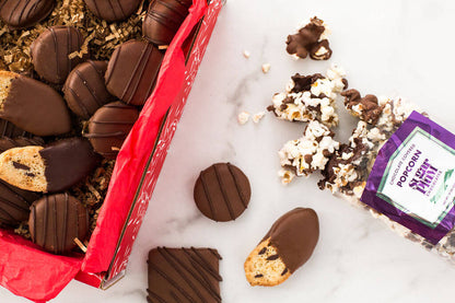 Chocolate Eruption Gourmet Gift Box with assorted hand-dipped treats, including cookies and popcorn, perfect for gifting or sharing.