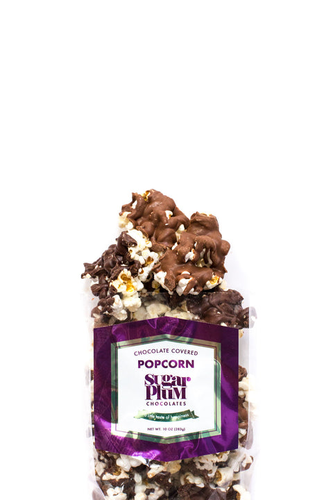 Gourmet sugar plum chocolate-covered popcorn pack with milk and dark chocolate, sweet and salty snack.