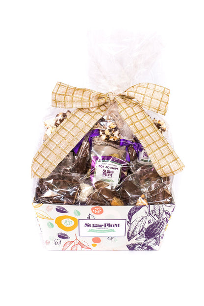 Sugar Plum Chocolate Matterhorn Gift Basket with a bow, featuring an assortment of handcrafted milk, dark, and white chocolate snacks.