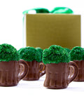 Milk chocolate beer mug assortment with green sprinkles, perfect for St. Patrick's Day celebration, boxed with festive ribbon.