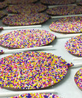 Easter Egg Nonpareil Lollipops with colorful sprinkles, perfect for festive Easter baskets, set of six chocolate treats.